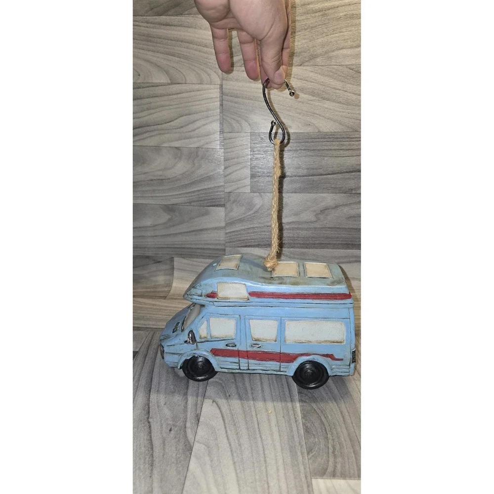 decorative birdhouse designed to look like a retro RV camper van